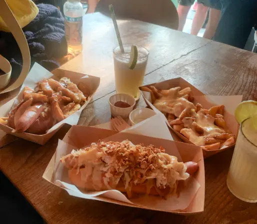 two hotdogs and cheesy chips