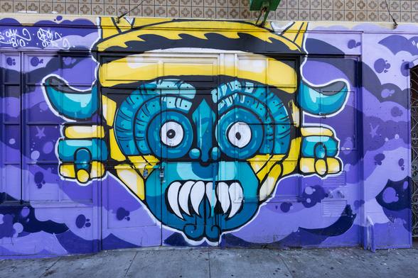 Mural with a stylized (Aztec? Mayan?) face