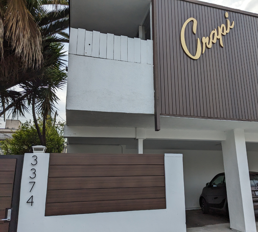 New paint on a classic LA apartment building. The sign says Crapi