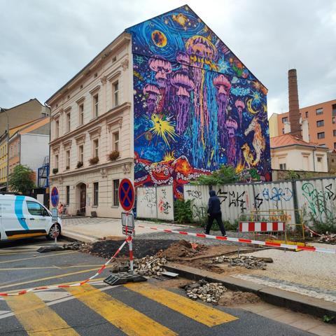 Surreal graffiti on gablewall depicting jellyfish, seahorses, octopus and galaxies