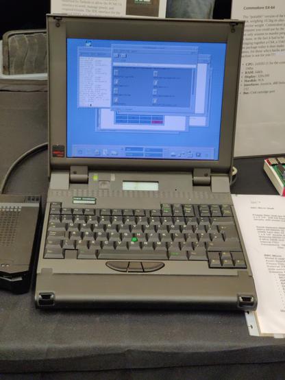 A photo of the Tadpole Sparcbook 3000XT displaying a CDE session with a file manager open and a few shells.