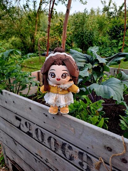 lianlian standing next to vegetable plants