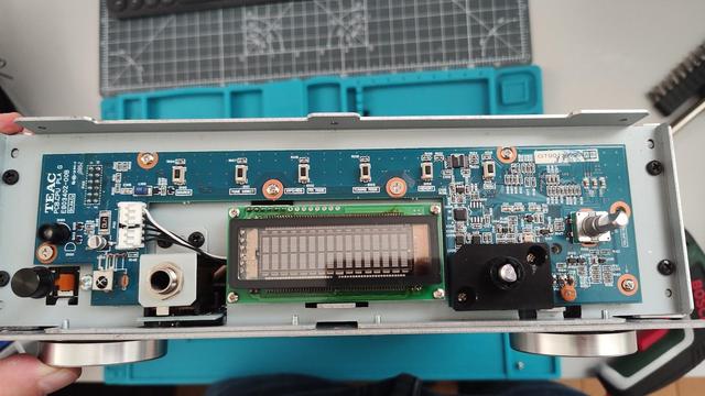 the electronics of the front panel of an old TEAC vintage amp