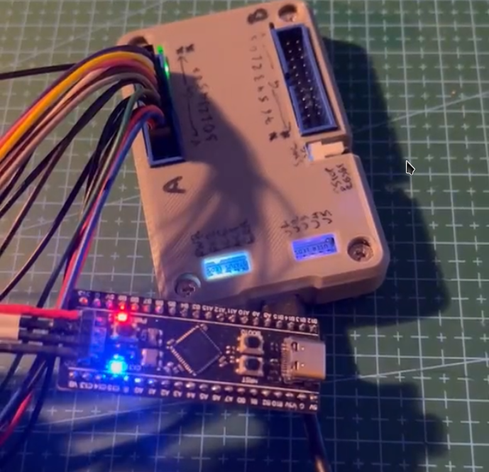 Glasgow connected to the STP32 411 black pill, with it running the rust blink example program.