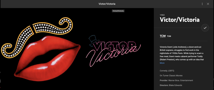 Screenshot of the Turner Classic Movie channel info page for the movie "Victor Victoria". The screen shot includes a graphic likely used as publicity for the movie. The graphic has a large set of red lips with a large dark gap between them with a mustache that curls at the ends and consists of a gold outline with white lights inside meant to appear like a theater marquee. To the right of the lips is a white circle. The name of the film is written within the circle but also extends beyond the circumference. "Victor" is written in all caps and each letter is in a blocky font with a pink outline and a black center. "Victoria" is written in a simple pale pink cursive below and extending up into the "Victor" graphic. There is a top hat made up of blue-green outline hanging on the upper left corner of the "V" in "Victor". The combo of the four graphics is intended to appear as a neon sign.