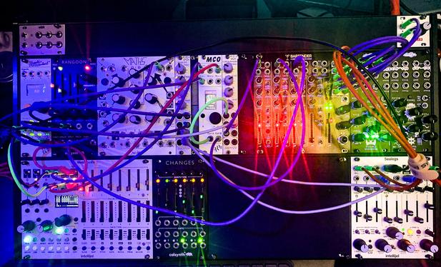 A close up of a collection of Eurorack modules assembled in a case.