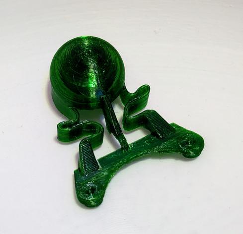 a 3D printed replacement part. The ball on top is supposed to move around in 2 axis. To enable that, three 3D printed springs connect it to the mount.