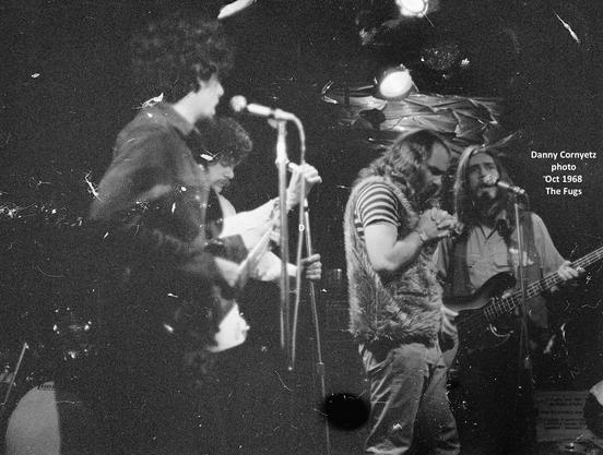 The Fugs playing on stage (probably): Tuli Kupferberg, Ed Sanders, Ken Weaver.