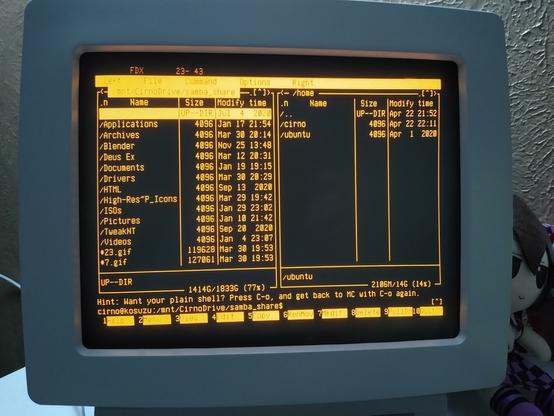 Dumb terminal with a classic amber CRT display.