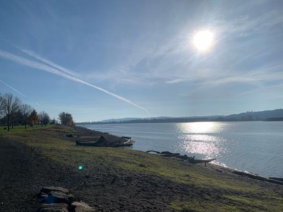 Looking Southward on the Columbia River from the Kalama, WA riverfront. This photo includes the sun and its reflection in the River.