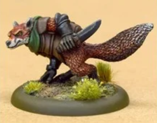 We have a miniature of an anthropomorphic fox. He's crouching with his head in line with his torso on the left side and his tail on the right. He has one hand on the ground whilst the other wields a dagger. He's wearing some dark armour with a green collar. On his face is a look of angry concentration.