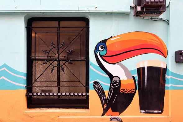 Photo of a window and Guinness-themed decoration on the west return (in Orange Row) of The Dorset public house at 28 North Road, City of Brighton & Hove, UK.