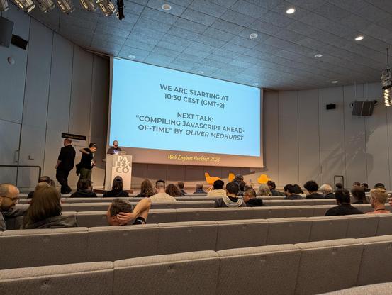 The main auditorium at the venue for the Web Engines Hackfest 2025, moments before the first morning talk.