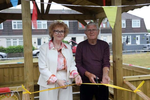 Councillor Jo Hale, Neath Port Talbot Council’s Cabinet Member for Adult Social Services and Alan Roberts, local resident and Chair of the Friends of Sandfields Community group, officially open Sandfields Community Garden.