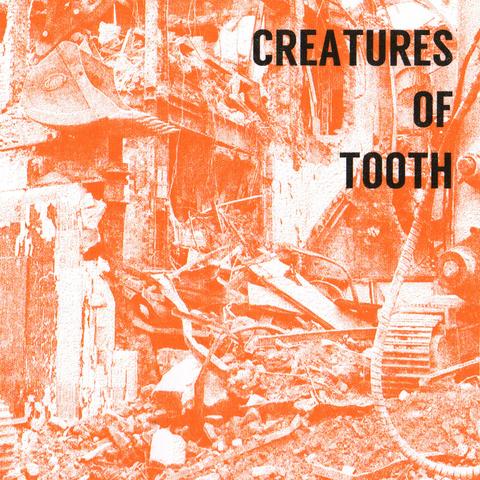 The cover of the Creatures of Tooth digital release. A partial photograph of a demolition site printed in bright orange ink, with black text in the top right corner saying 'CREATURES OF TOOTH'.