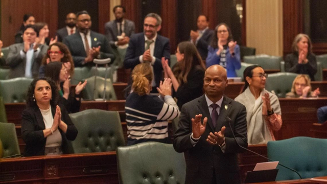 House Speaker Emanuel “Chris” Welch and members of his Democratic caucus applaud members of their staff early Sunday morning after the chamber approved the $55.2 billion budget bill. (Capitol News Illinois photo by Jerry Nowicki)