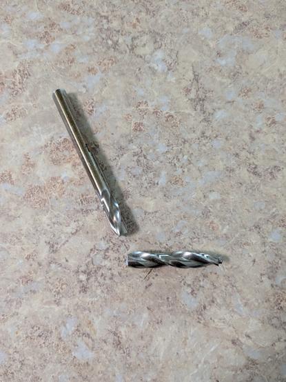 A large drill bit broken in two