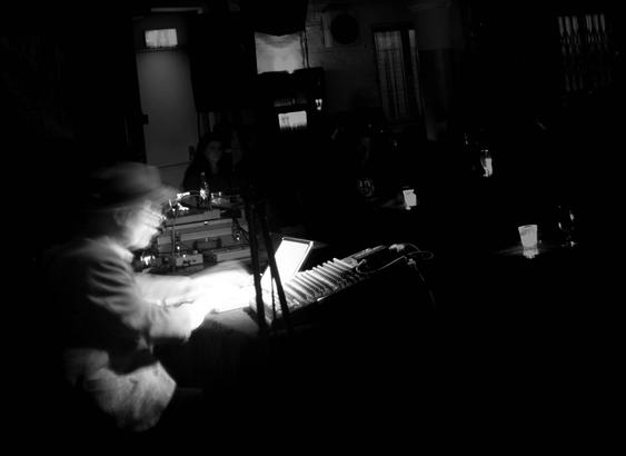 An array of pixels reconstructed as an image of Yasunao Tone performing at cafe OTO in 2015