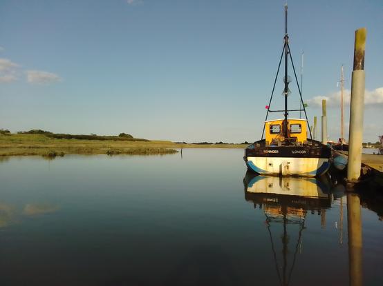 Bagsy this berth when we launch (which is still some time off). View from the rowing dinghy mooring pontoon to the right with a fishing boat tied up alongside, the saltmarsh to the left at high water.