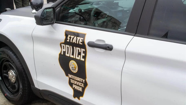 A cruiser with an Illinois State Police logo on the door