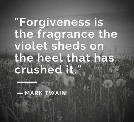 A black and white image featuring a field of dandelions as a backdrop. Overlaid on the image is a quote from Mark Twain: "Forgiveness is the fragrance the violet sheds on the heel that has crushed it." The text is in a sans-serif font and styled to stand out against the background, making the quote the focal point. The image evokes a sense of resilience and beauty emerging from hardship.