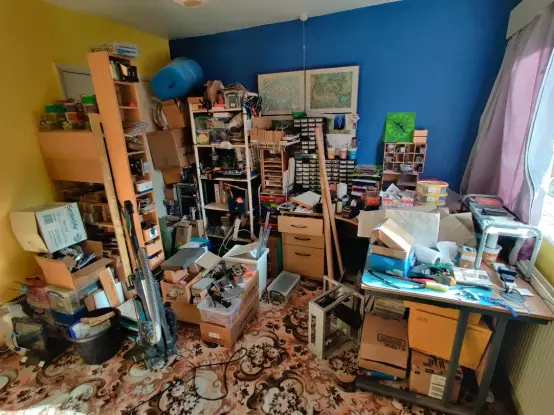 A cacophony of mess caused in the current RC2014 office (well, spare bedroom) as everything has had to be moved to allow access to get a desk out. There are piles of boxes, components, packaging and all kinds of stuff all over the place.