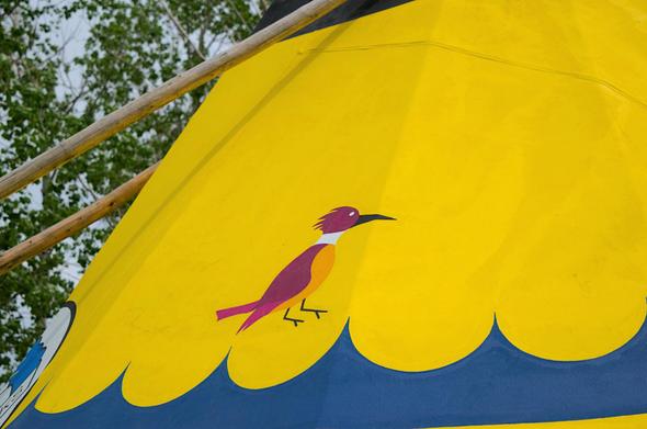The close-up of a woodpecker painted on a tipi