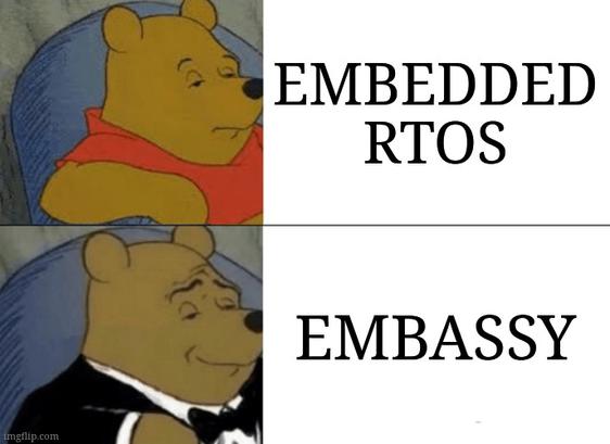 This meme humorously contrasts traditional embedded RTOS with "Embassy," a modern asynchronous framework for embedded systems in Rust. Using the "Tuxedo Winnie the Pooh" format, it suggests that while standard RTOS is fine, Embassy is a more elegant and sophisticated solution, appealing to developers who prefer modern, safe, and efficient approaches.
