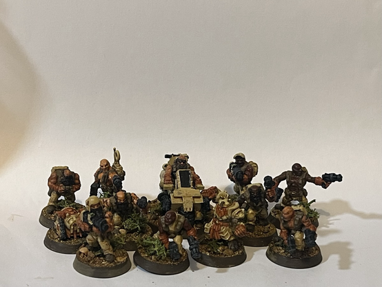 A collection of sci-fi dwarf minis in desert uniforms.