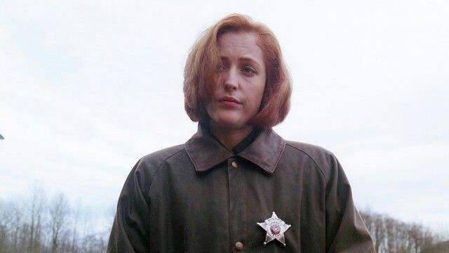 Scully with "done with your shit" facial expression. Star badge.