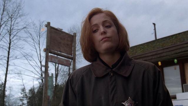 Scully with "done with your shit" facial expression. Looking down.