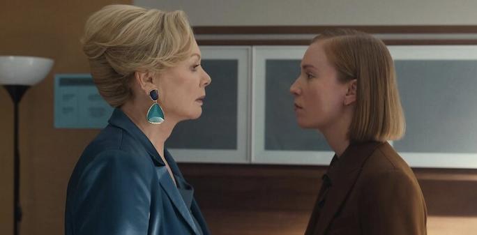 Jean Smart and Hannah Einbinder face to face, possibly arguing. they are in an office. Jean's blonde hair is in a bun, Hannah's straight bob hangs to her shoulders.
