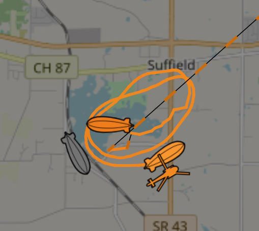 Map showing three yellow blimp icons along with a helicopter icon circling.