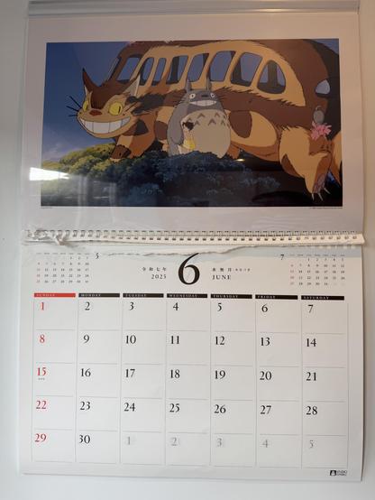 My Studio Ghibli calendar from Japan. The art is from My Neighbour Totoro and shows Catbus, Totoro, and Satsuki sat in a tree.

Totoro is a fluffy creature that stands on its hind legs and has a big grin.

Catbus is a giant cat who is also a bus.

Satsuki is a young girl in a yellow dress.