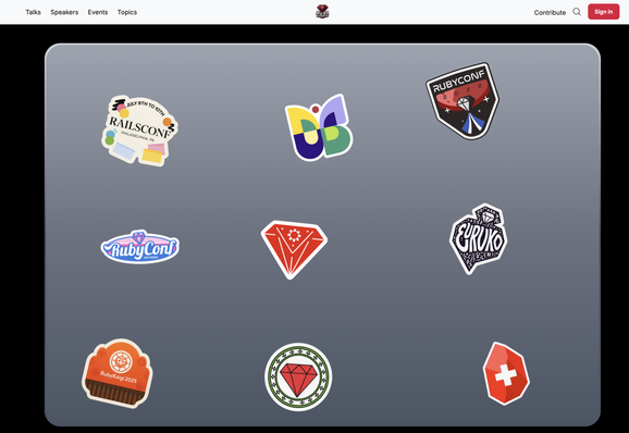 A laptop covered with Ruby event stickers on RubyEvents.org.