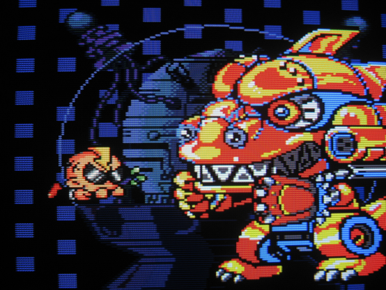 PC Denjin prepares to fight a gigantic dinosaur mech that fills up nearly half of the screen. This seems like an unfair fight. For the dinosaur.