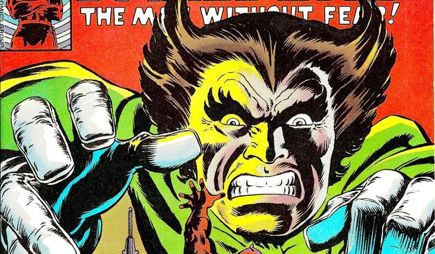 The Owl, a supervillain from Marvel comics, on a cropped cover of an issue of Daredevil, giant and snarling as he reaches for Daredevil, who is barely visible.