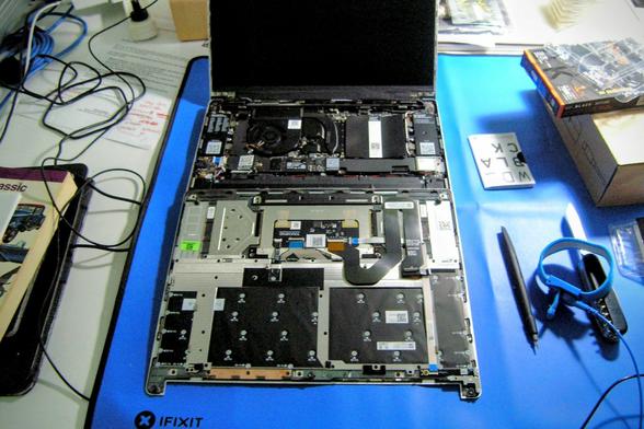 Attaching the touch pad cable.