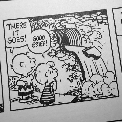 A black-and-white comic panel featuring two characters, one with a round head and striped shirt and the other with a round head and a zigzag-patterned shirt. They stand by a large drain pipe, watching something flow out.