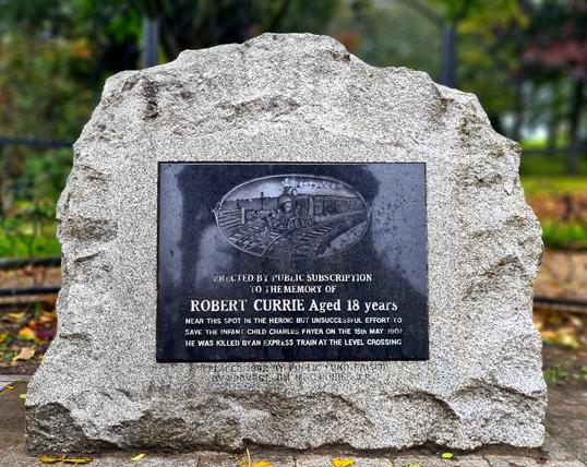 A memorial to Robert Currie, Aged 18, who was killed by a train in 1907 while trying to save a two-year old boy.