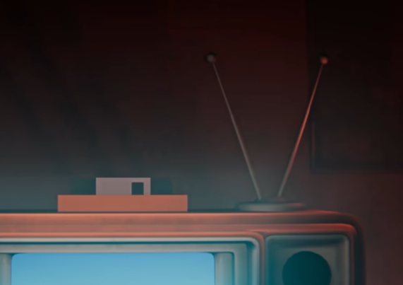 Not only is the floppy disk is lowered into a slot on top of a CRT television, but it is inserted backwards with the shutter that allows access to the actual disk inside of the case dangling out.