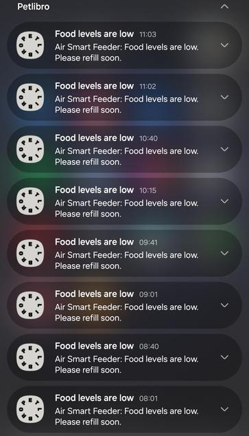 A screenshot of a phone notification screen showing 8 notifications saying "Air Smart Feeder: Food levels are low. Please refill soon." The most recent two being 1 minute apart.