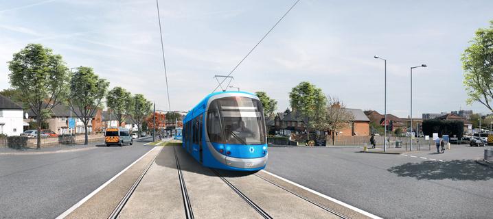 A West Midlands Metro tram, coloured blue, is shown on tram tracks that run down the middle of a road. Trees line both sides of the road, and buildings are visible in the background.