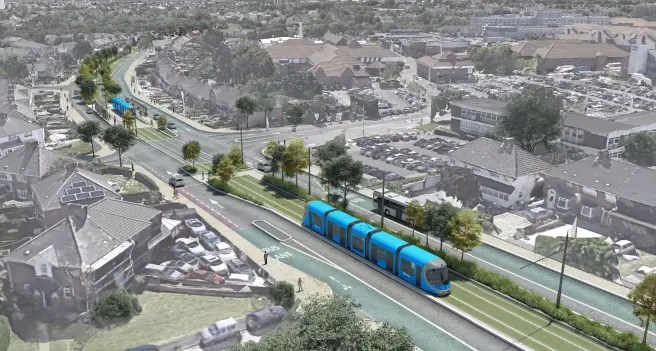 An aerial rendering shows a wide road with a bright blue tram on tracks running along a central reservation. The tram is sleek and modern, with multiple carriages. To the right of the tram tracks is a "BUS LANE". On either side of the road are rows of houses and other buildings, with parked cars visible in driveways and car parks. The overall impression is of a well-planned urban area with integrated public transport.