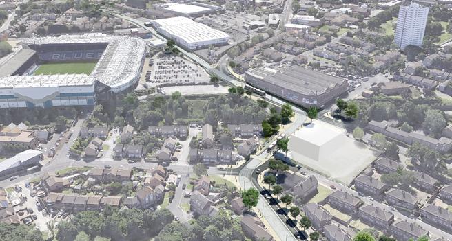An aerial render of a modern urban development with a large stadium on the left, identified as St. Andrew's, home of Birmingham City FC. A new road or tram line runs from the stadium towards the right, flanked by trees and new buildings, including a large white building under construction. The surrounding area consists of residential streets with terraced houses.