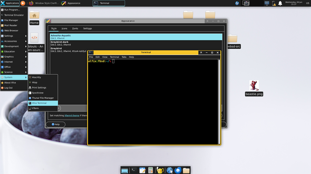 A screenshot of a FreeBSD desktop environment running Xfce with a dark theme / high contrast for low vision users.