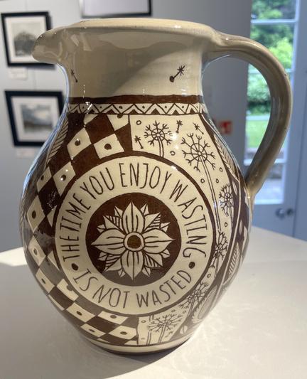 Side view of highly decorated sgraffito jug.