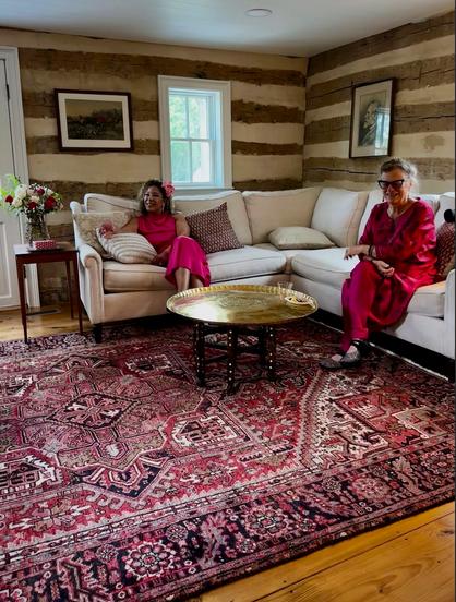 My sister sitting with the groom's mother. Yes, that's Robert E. Lee on the wall. When you pick a rural Virginia B&B as a destination wedding, you get what you get. We all rolled with it.