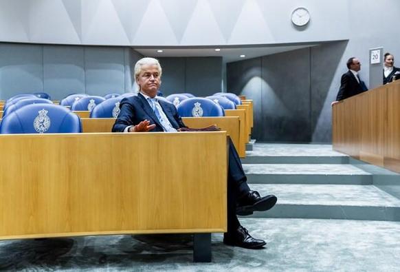 Wilders hanging in his seat with empty seats all around him.
