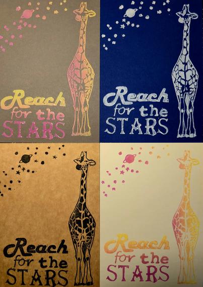 4 linoprints - all have the same print, but the colours differ. They show a giraffe and the text 'Reach for the stars', and some stars and planets are at the top of the print.